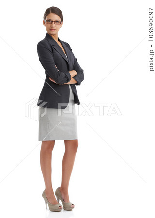 Ready to take on the corporate world. Studio shot of an confident young businesswoman isolated on white. 103690097