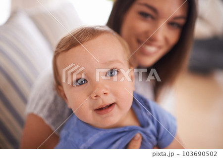 She takes after her mom. An adorable little girl with her mother. 103690502