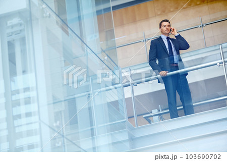Corporate, travel or businessman on phone call for communication, networking or contact in office building. Company office, staircase or CEO with smartphone for discussion, speaking or conversation Corporate, travel or businessman on phone call for communication, networking or contact in office building. Company office, staircase or CEO with smartphone for discussion, speaking or conversation 103690702
