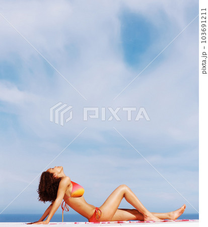 Relax, sexy and bikini with body of woman at beach for sunbathing, tropical and peace on Brazil vacation. Summer break, sun and blue sky with girl on deck of resort for travel and mockup Relax, sexy and bikini with body of woman at beach for sunbathing, tropical and peace on Brazil vacation. Summer break, sun and blue sky with girl on deck of resort for travel and mockup 103691211