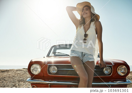 Road tripping is the ultimate freedom. an attractive young woman on a road trip. Road tripping is the ultimate freedom. an attractive young woman on a road trip. 103691301