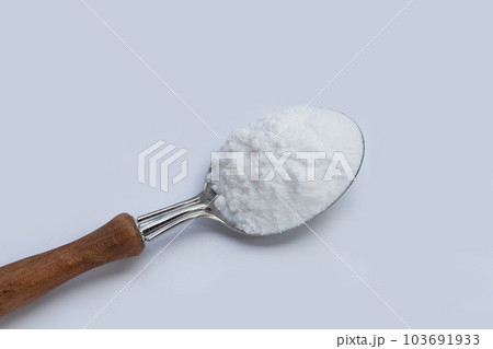 Baking soda on white background. Baking soda on white background. 103691933