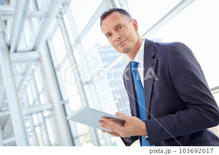 Portrait, planning or business man on tablet for invest strategy, finance growth or financial review. Networking manager in office building for social network, data analysis or economy data research 103692017