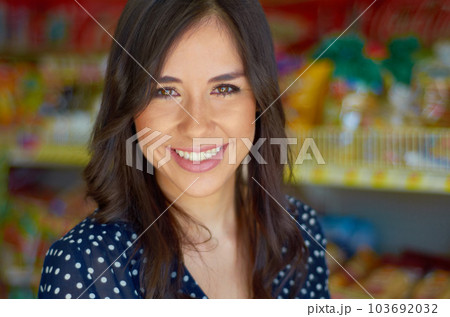 Young woman, portrait and smile in grocery store for shopping, discount and sale for customer experience. Shop owner, small business and female entrepreneur in supermarket with pride, happy and goals 103692032