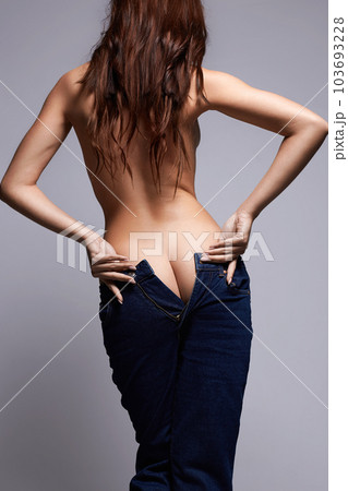 Sexy Back of Woman in jeans. Brunette Girl with long Hair Sexy Back of Woman in jeans. Brunette Girl with long Hair 103693228
