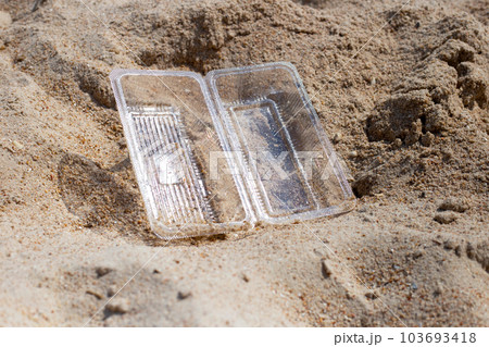 Plastic food container on the beach 103693418