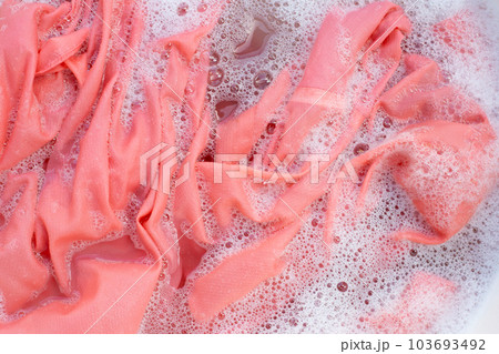 Top view of formal shirts soak in powder detergent water dissolution. Laundry concept 103693492