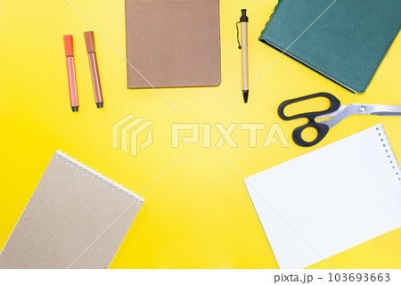 Back to school. Education flat lay. Business layout. Mock up, notepads, pen, marker, scissors on yellow background. Workplace. Copy space 103693663