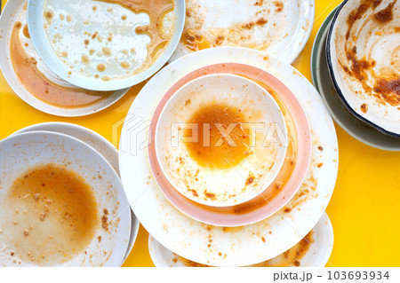 Dirty dishes on yellow background. Top view Dirty dishes on yellow background. Top view 103693934