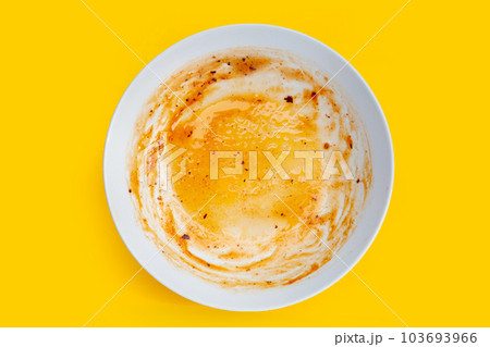 Dirty dish on yellow background. Top view Dirty dish on yellow background. Top view 103693966