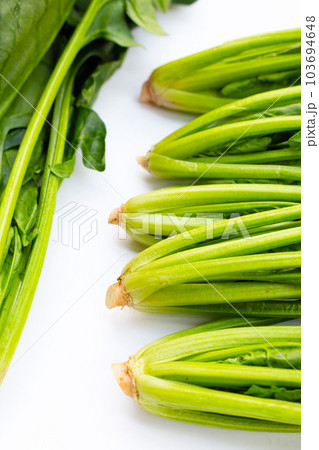 Fresh spinach on white background Fresh spinach on white background 103694648