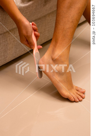 Foot with foot file, Cleansing the heel Foot with foot file, Cleansing the heel 103694667