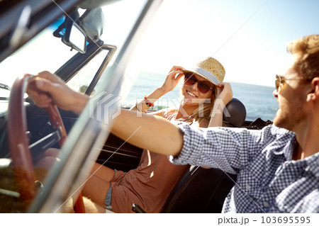 Car road trip, travel and driving couple on bonding holiday adventure, transportation journey or fun summer vacation. Love flare, convertible automobile and driver on Canada nature countryside tour Car road trip, travel and driving couple on bonding holiday adventure, transportation journey or fun summer vacation. Love flare, convertible automobile and driver on Canada nature countryside tour 103695595