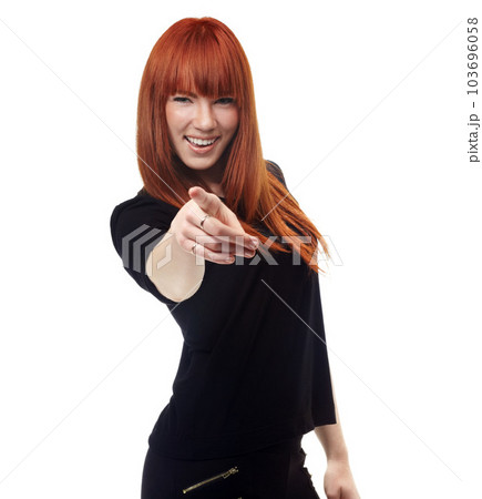 Portrait, choice and pointing with a ginger woman in studio isolated on a white background for motivation. Smile, accountability and hand gesture with a happy young female person making a decision 103696058