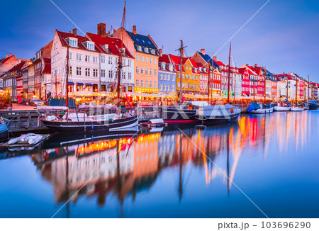 Copenhagen, Denmark. Nyhavn, Kobenhavn's iconic canal, colorful night water reflection. Copenhagen, Denmark. Nyhavn, Kobenhavn's iconic canal, colorful night water reflection. 103696290