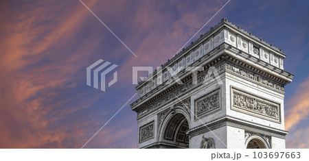 Arc de Triomphe (against the background of sky with clouds), Paris, France. The walls of the arch are engraved with the names of 128 battles and names of 660 French military leaders (in French) Arc de Triomphe (against the background of sky with clouds), Paris, France. The walls of the arch are engraved with the names of 128 battles and names of 660 French military leaders (in French) 103697663