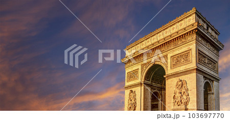 Arc de Triomphe (against the background of sky with clouds), Paris, France. The walls of the arch are engraved with the names of 128 battles and names of 660 French military leaders (in French) 103697770