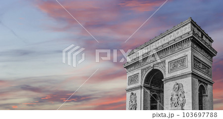 Arc de Triomphe (against the background of sky with clouds), Paris, France. The walls of the arch are engraved with the names of 128 battles and names of 660 French military leaders (in French) 103697788