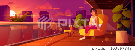 Woman sitting on terrace in armchair at sunset 103697845