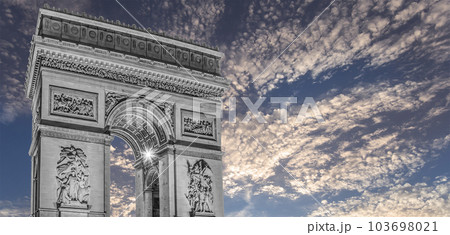 Arc de Triomphe (against the background of sky with clouds), Paris, France. The walls of the arch are engraved with the names of 128 battles and names of 660 French military leaders (in French) Arc de Triomphe (against the background of sky with clouds), Paris, France. The walls of the arch are engraved with the names of 128 battles and names of 660 French military leaders (in French) 103698021