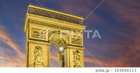 Arc de Triomphe (against the background of sky with clouds), Paris, France. The walls of the arch are engraved with the names of 128 battles and names of 660 French military leaders (in French) Arc de Triomphe (against the background of sky with clouds), Paris, France. The walls of the arch are engraved with the names of 128 battles and names of 660 French military leaders (in French) 103698113