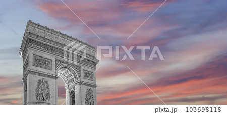 Arc de Triomphe (against the background of sky with clouds), Paris, France. The walls of the arch are engraved with the names of 128 battles and names of 660 French military leaders (in French) 103698118