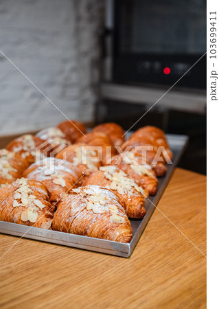 ready-made croissants on a baking sheet 103699411