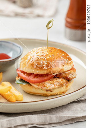 Portion of burger with french fries Portion of burger with french fries 103699703