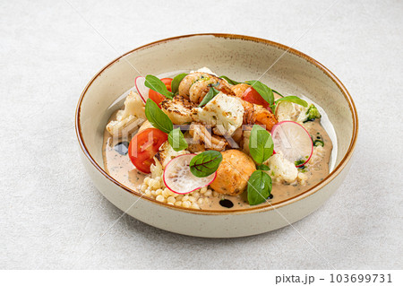 Portion of dish with ptitim and seafood Portion of dish with ptitim and seafood 103699731