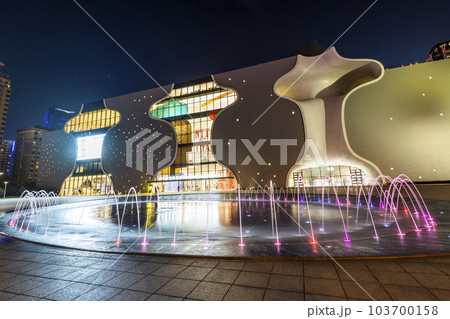 Fountain view in front of the National Taichung Theater in Taiwan and the surrounding modern architecture. Fountain view in front of the National Taichung Theater in Taiwan and the surrounding modern architecture. 103700158