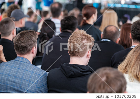 Group of people discussing business strategy in conference room 103700209
