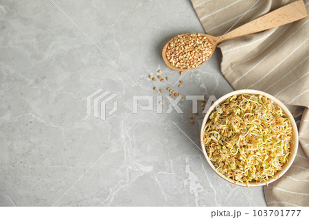 Flat lay composition with green buckwheat on light grey table, space for text Flat lay composition with green buckwheat on light grey table, space for text 103701777