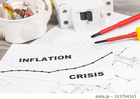 Various electrical components, work tools, installation plan, inscriptions inflation and crisis 103704565