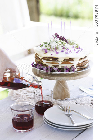 beautiful cake with candles on the background of nature beautiful cake with candles on the background of nature 103705974