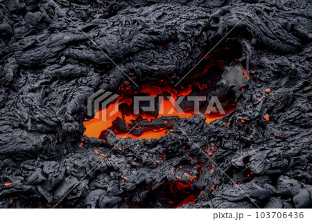 Volcano. Lava. Magma. Volcanic cone with lava and eruption of hot rocks. Volcanic cone. Night. 103706436