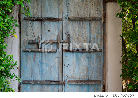 Beautiful Blue Ancient Door in the Park, Outdoor Rustic and Antique Fantasy Doorway Beautiful Blue Ancient Door in the Park, Outdoor Rustic and Antique Fantasy Doorway 103707057