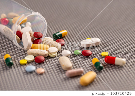 Pills spilled out of the can Pills spilled out of the can 103710429