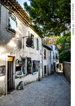 Narrow Alley With Ancient Buildings In The Ancient Fortress Of Medieval City Carcassonne In Occitania, France 103713589