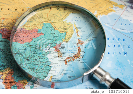 Bangkok, Thailand - January 20, 2022 Japan, Magnifying glass close up with colorful world map, travel, geography, tourism and exploration concept. Bangkok, Thailand - January 20, 2022 Japan, Magnifying glass close up with colorful world map, travel, geography, tourism and exploration concept. 103716015