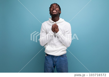 handsome american man casual wear with idea on blue background 103716572