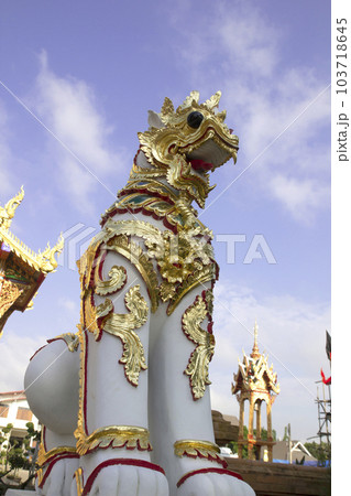 lion statue in front of the gate of a thai temple lion statue in front of the gate of a thai temple 103718645