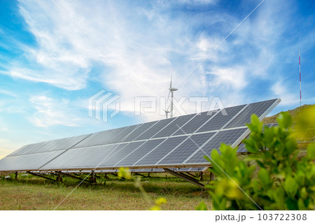 Solar photovoltaic panels and wind turbines. Energy concept Solar photovoltaic panels and wind turbines. Energy concept 103722308