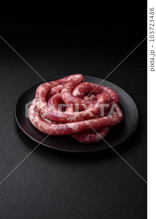 Raw sausages from pork or beef with salt, spices and herbs 103723486
