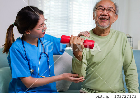 Elderly adult exercising by lifting weights at home, Medical treatment concept Elderly adult exercising by lifting weights at home, Medical treatment concept 103727173