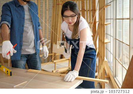 Professional carpenter with handicraft working in carpentry shop Professional carpenter with handicraft working in carpentry shop 103727312