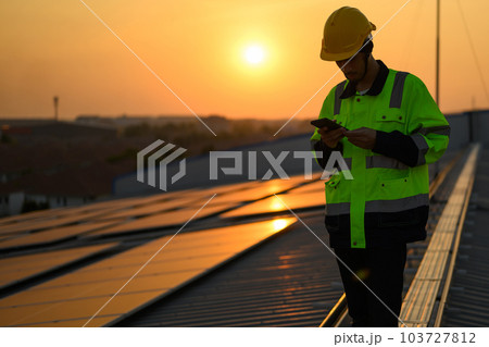 Silhouette of technician engineer checking and repairing solar panels 103727812