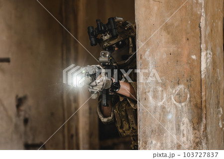 Expert team of soldiers with weapons attacking enemy 103727837