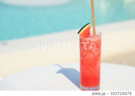 Refreshing cold tropical watermelon fruit juice smoothie on table Refreshing cold tropical watermelon fruit juice smoothie on table 103728078