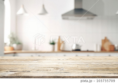 Empty Wood table top on blurred kitchen background.. Empty Wood table top on blurred kitchen background.. 103735709