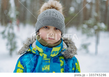 winter portrait of cute caucasian boy on sunny day 103743296